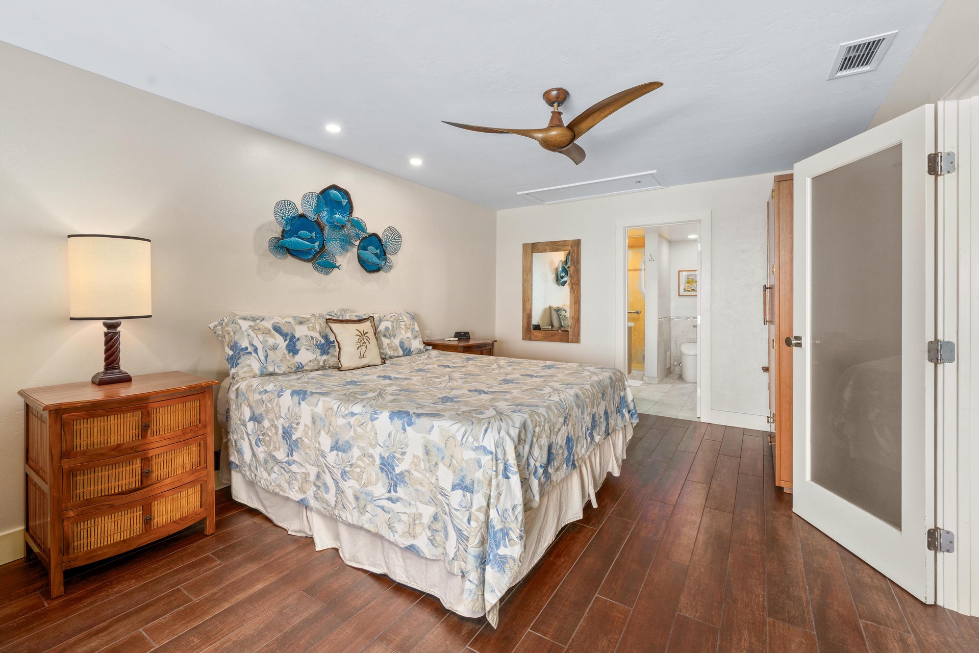 Primary bedroom features a California King bed