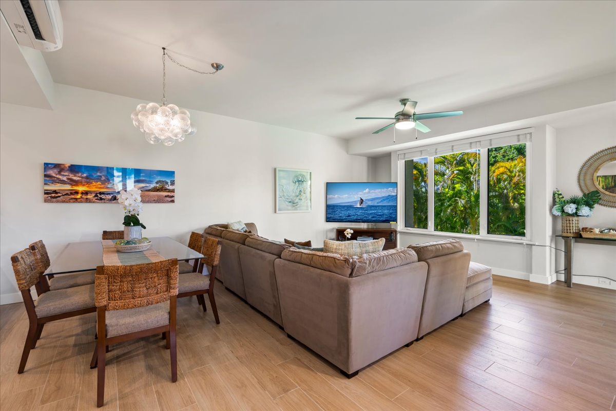Relax in your bright, open-plan living and dining space, complete with modern comforts and lush garden views through the window. This inviting area is perfect for unwinding or sharing meals after a day of island exploration.