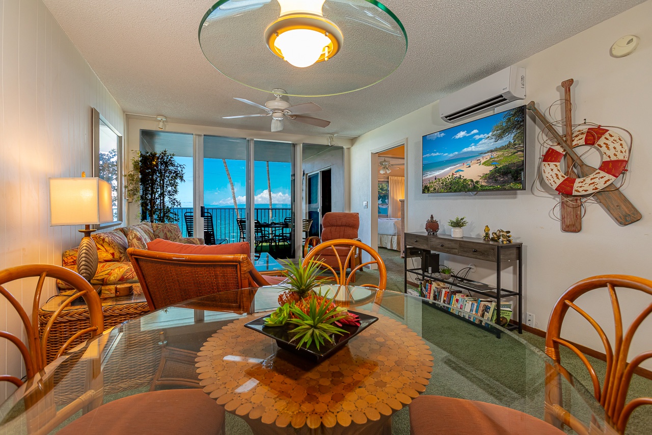 Living room and dining area with an open concept. 