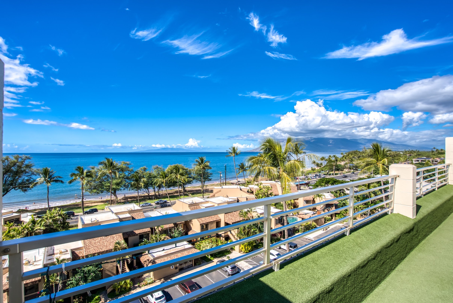 This rooftop terrace offers sweeping views of the coast, palm-lined shore, and distant island vistas—an ideal arrival backdrop showcasing the property's tropical beachfront location.