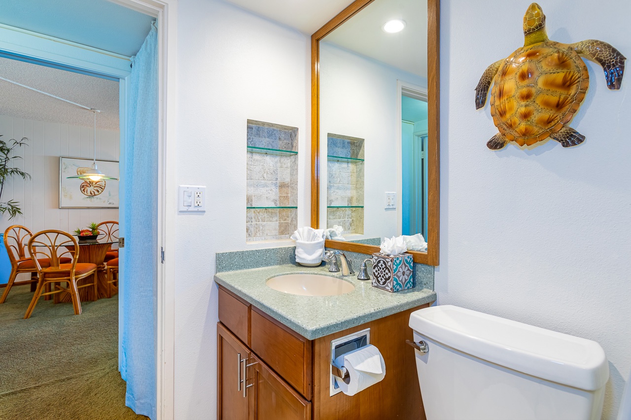 Guest bathroom with shower located near the guest bedroom. 