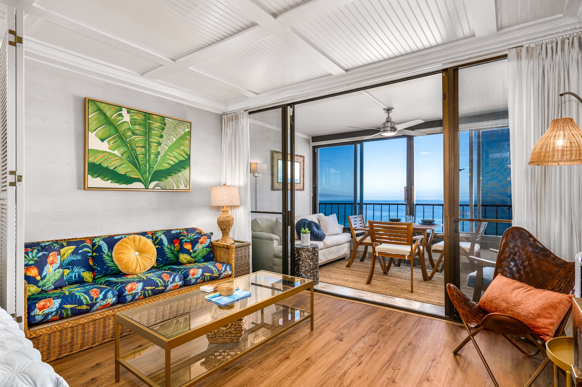 Sink into this tropical-inspired living space, where colorful patterns meet coastal charm.