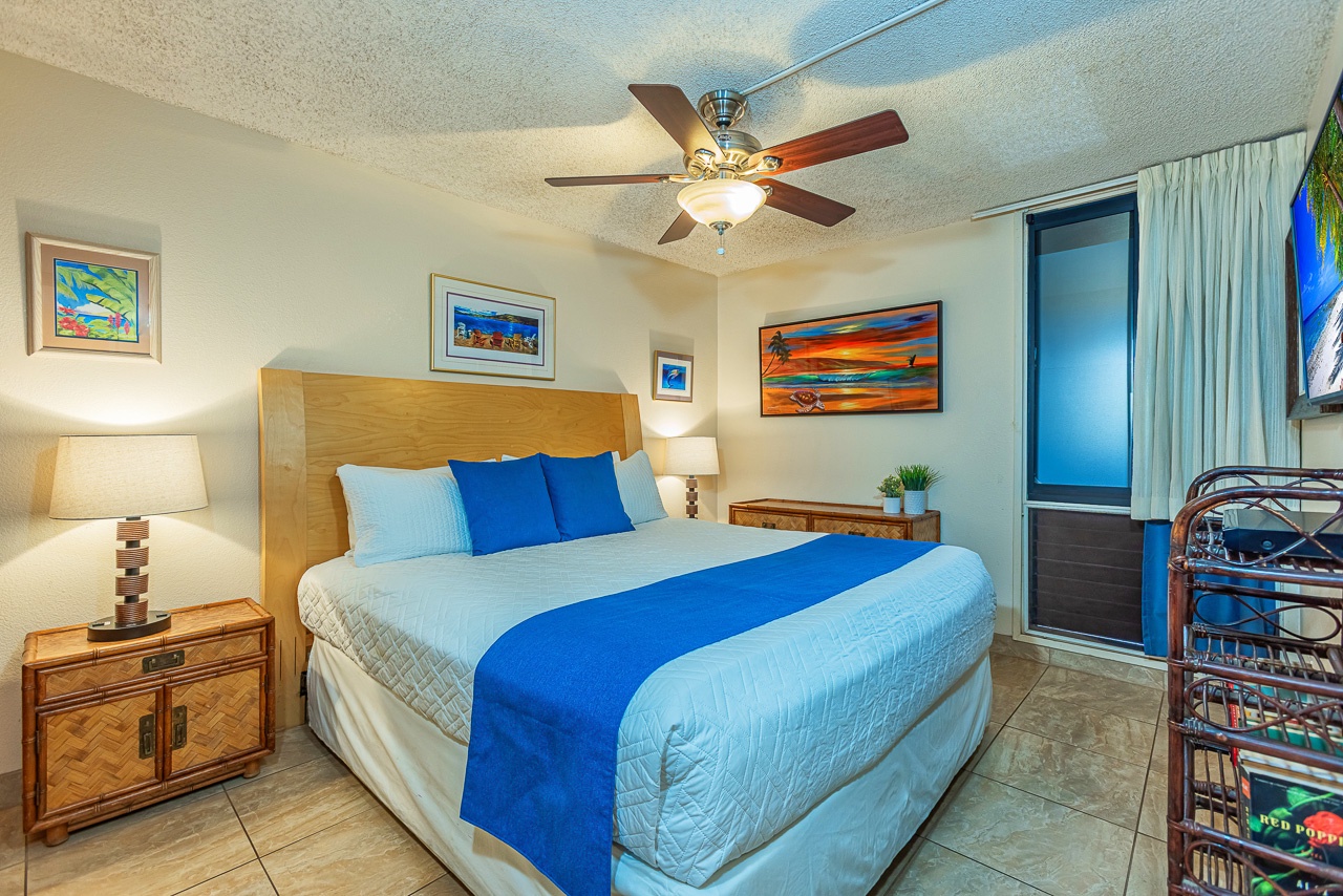 Your serene bedroom retreat features a king-size bed with crisp coastal linens and charming beach-inspired artwork.