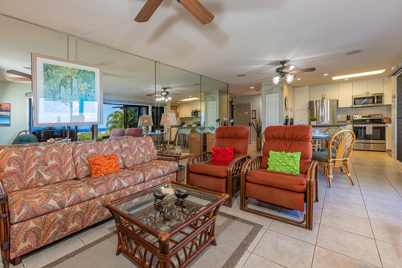 Step into your island home with open-concept living that flows seamlessly from lounge to kitchen. Colorful accents and tropical-inspired furnishings invite you to unwind in comfort while ceiling fans keep the space cool and breezy.