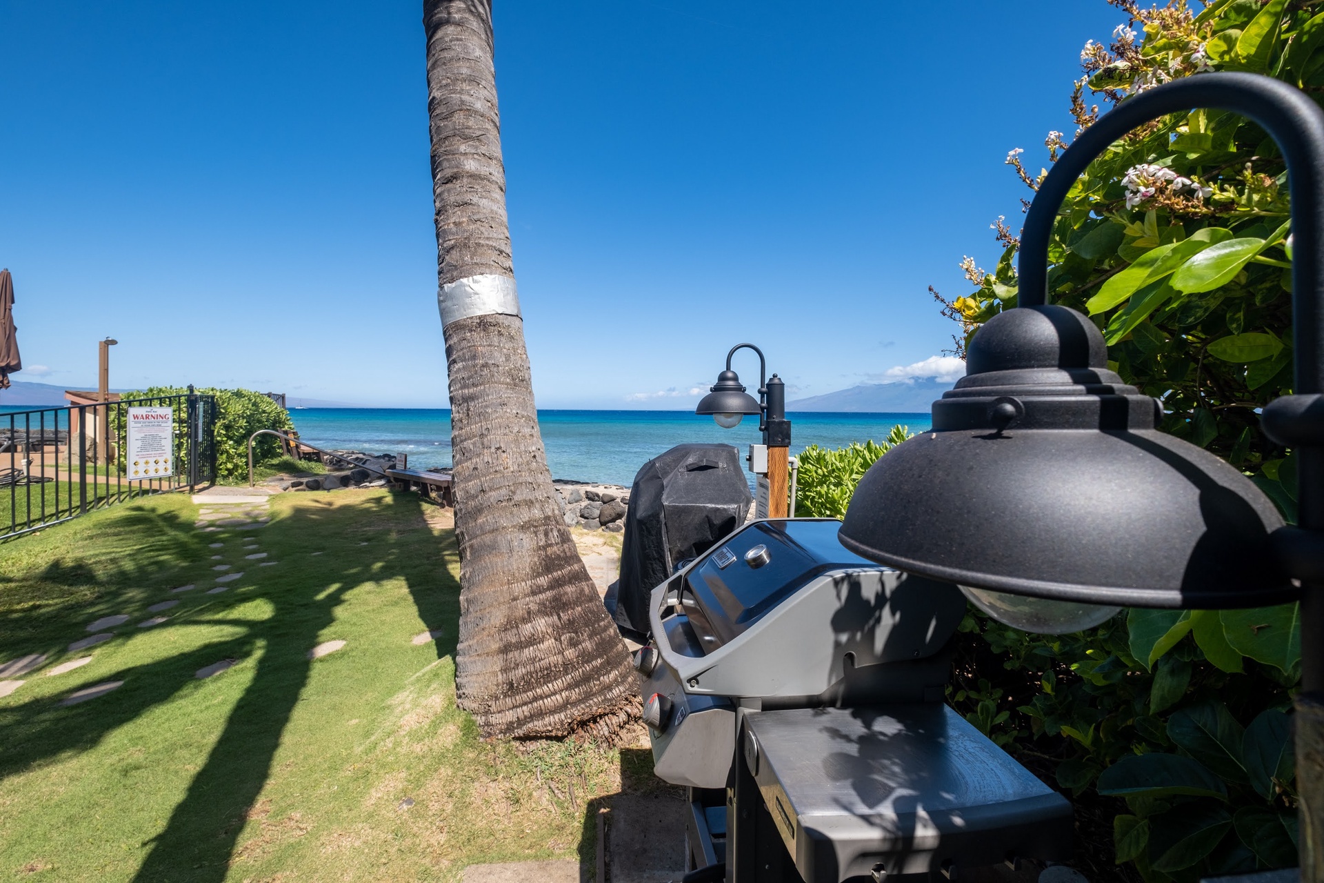 Tropical beachfront setting with community BBQ's for guest use.