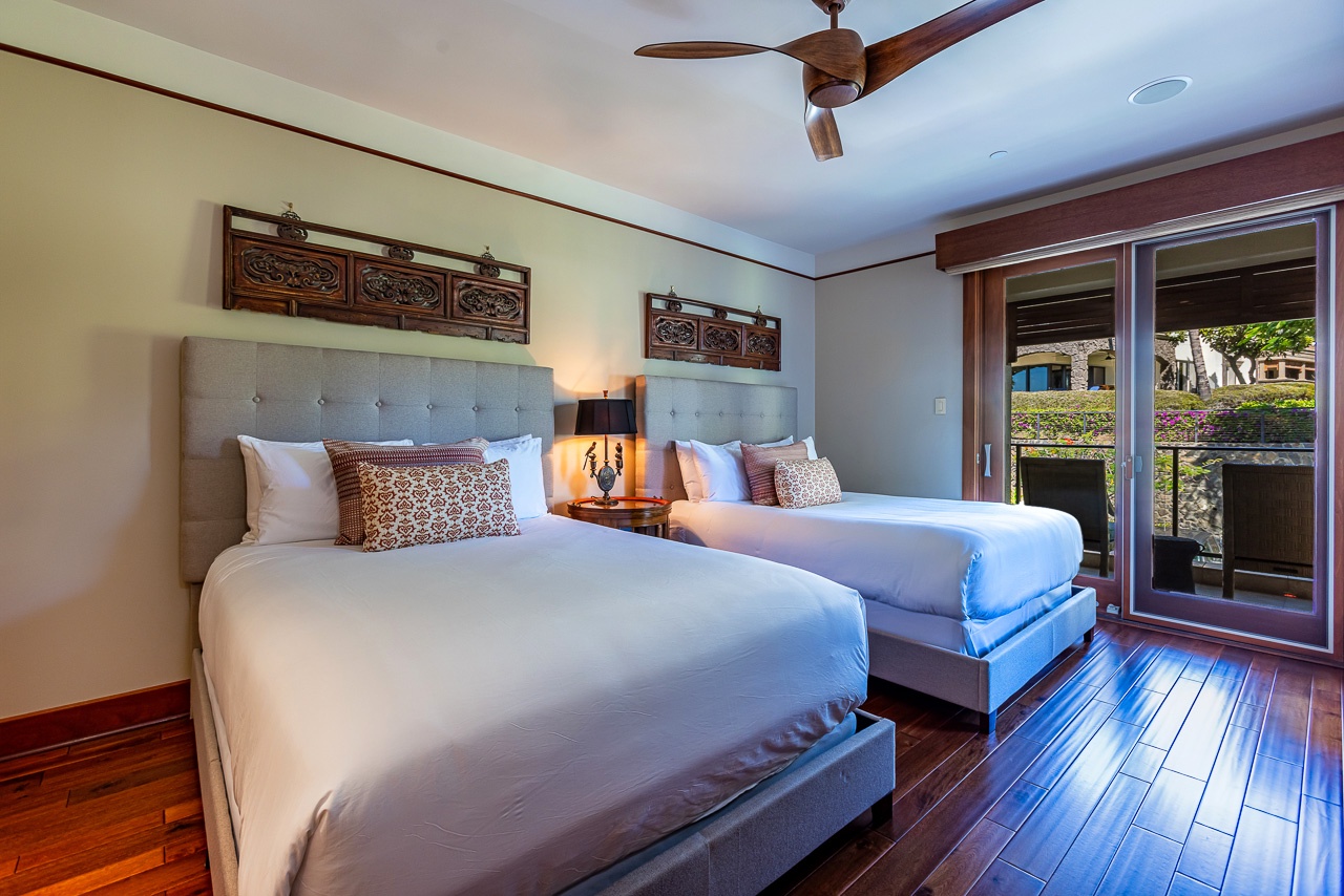 Sink into plush beds with crisp linens and decorative cushions, then step outside to your private garden view—your restful retreat awaits.