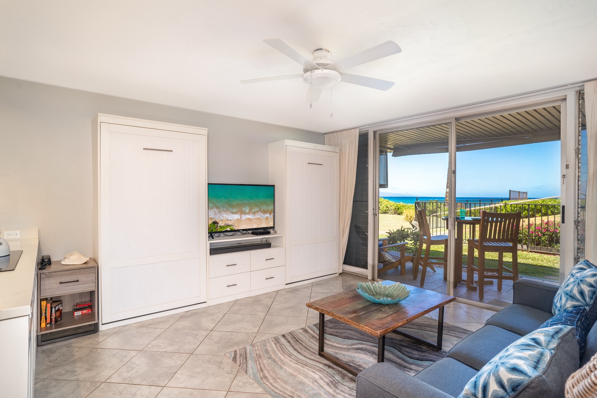Spacious living room with TV and comfortable seating.