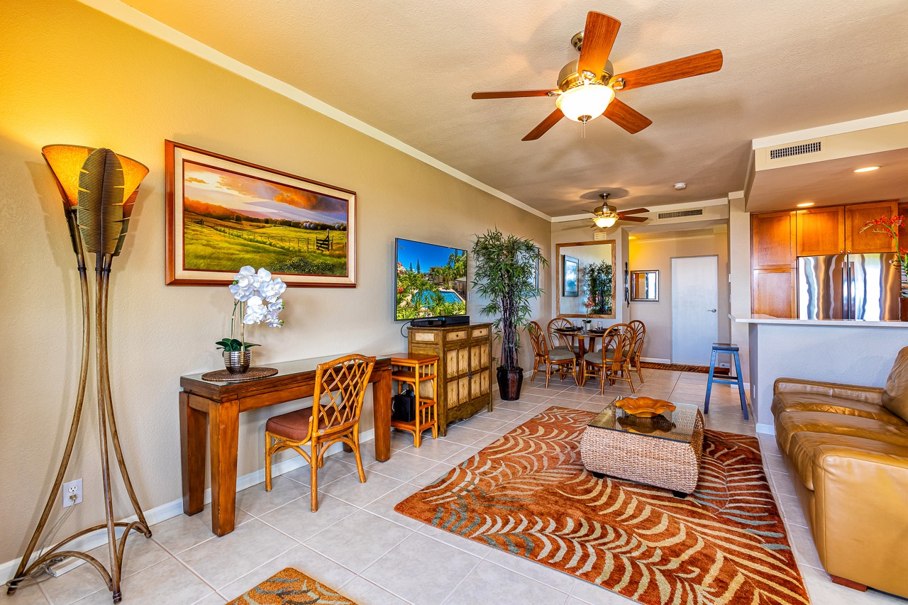 Step into your sunlit island retreat, where warm woods and tropical touches invite you to unwind. Ceiling fans keep you cool as you relax in the open living space that flows seamlessly into the dining area and kitchen.