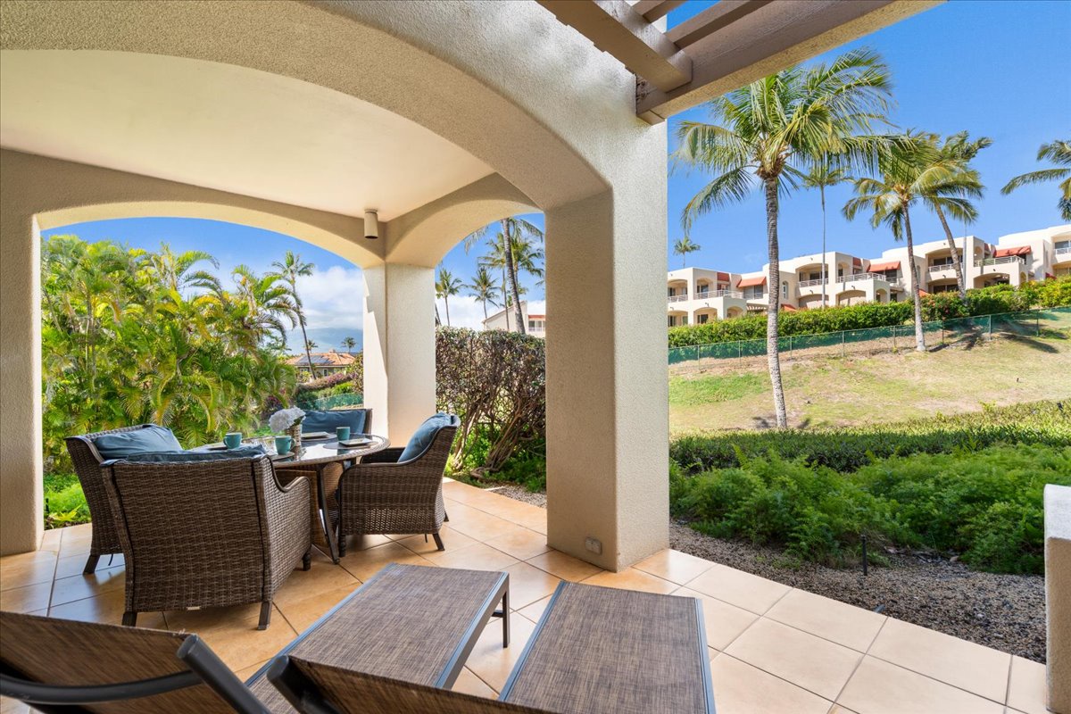 Corner lanai with several seating options and connected to primary bedroom