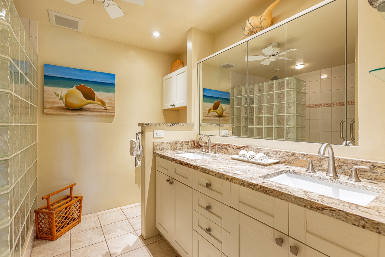 Step into your private spa-like retreat with dual vanities, elegant granite counters, and fresh towels awaiting your arrival.