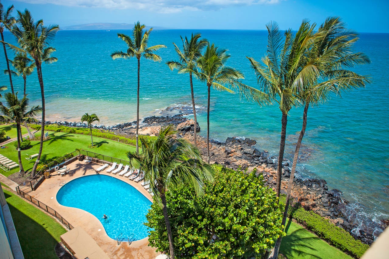 Relax poolside with panoramic Maui views