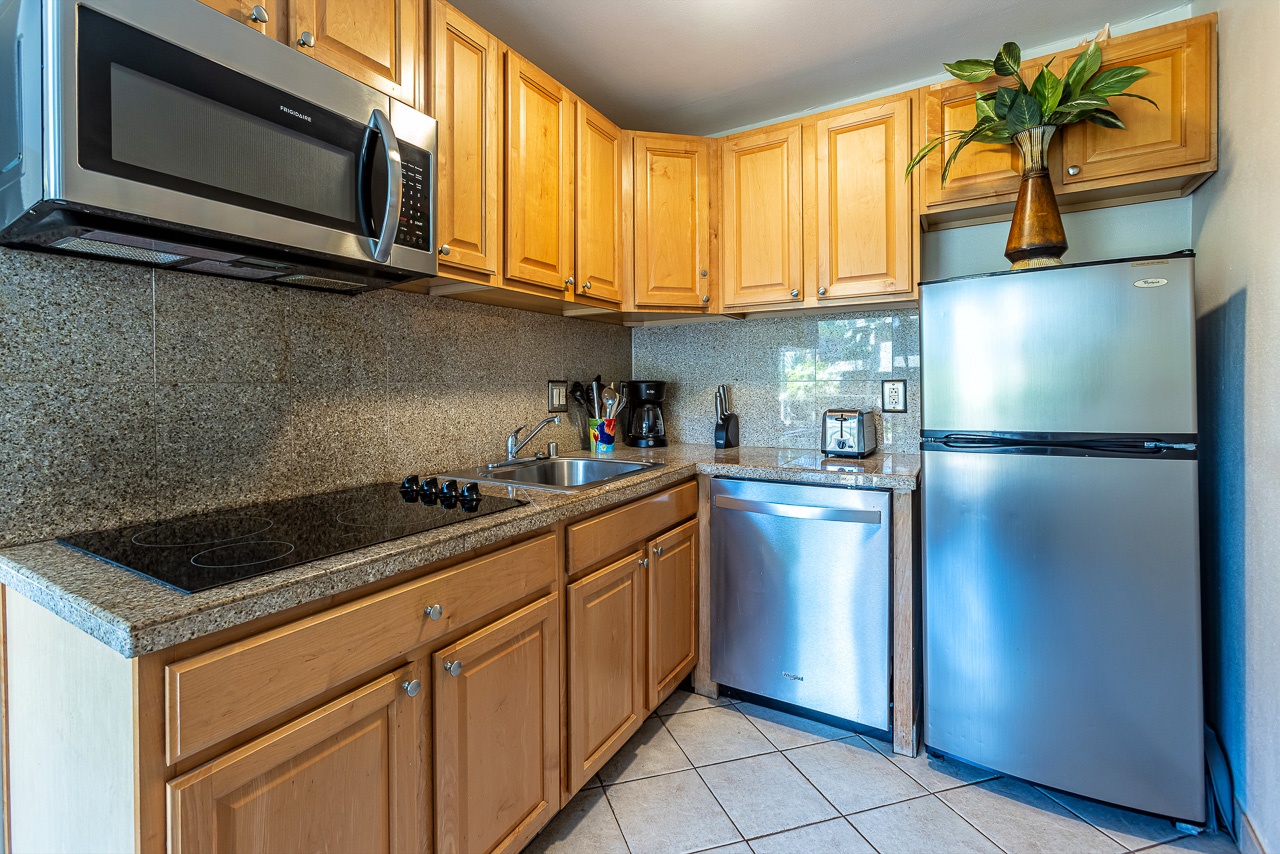 Your fully equipped kitchen features modern stainless steel appliances, granite countertops, and all the essentials to prepare your favorite meals during your stay.