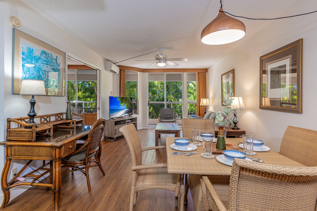 Sunlit living room with easy access to the lanai and fresh air