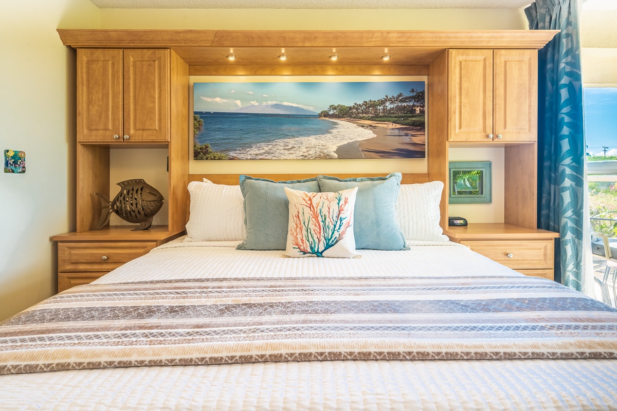 Sink into coastal comfort on your plush bed with beach-inspired artwork and built-in storage. Ocean hues and soft linens create a serene retreat for restful nights.