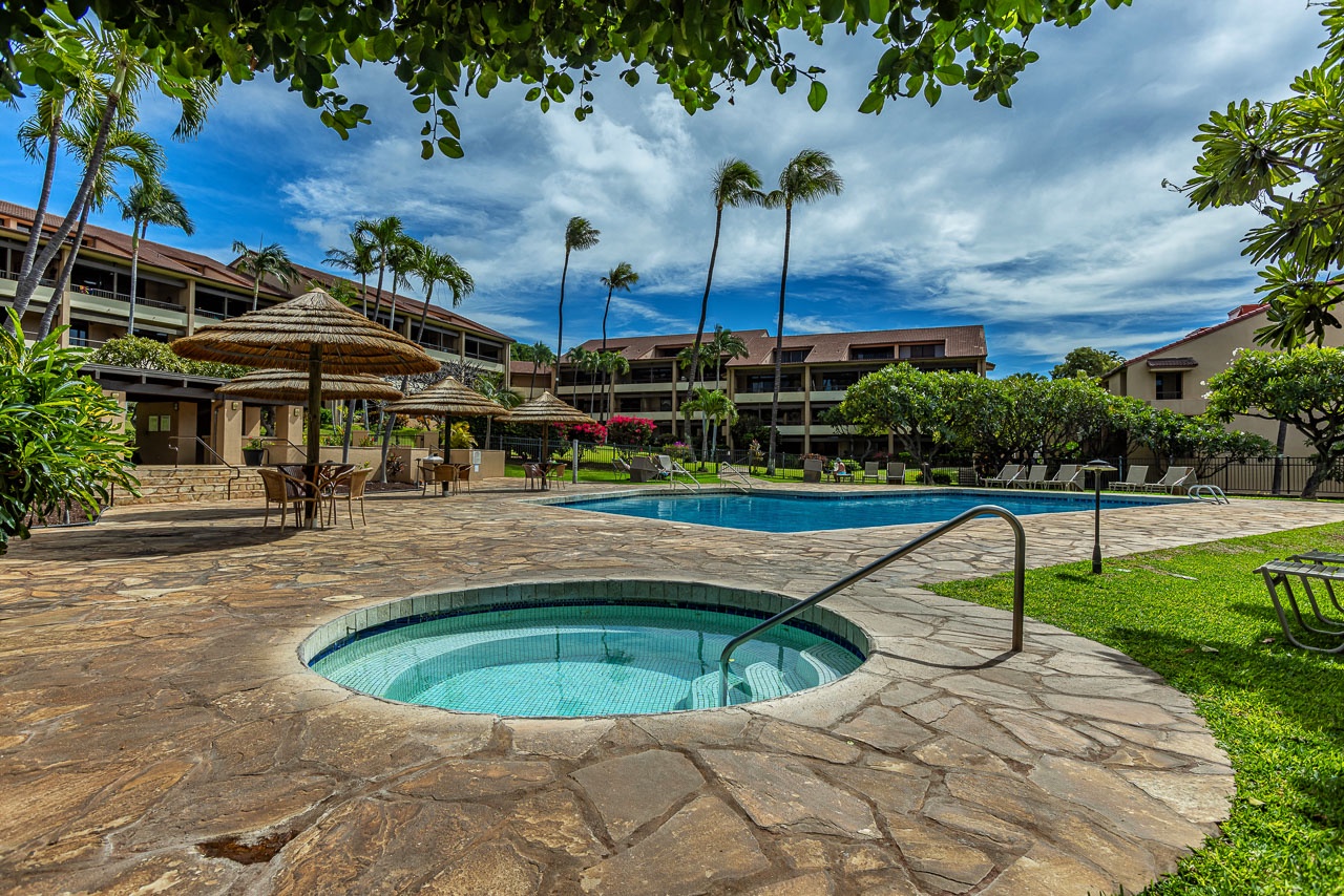 A tranquil tropical escape with a sparkling pool and relaxing hot tub.