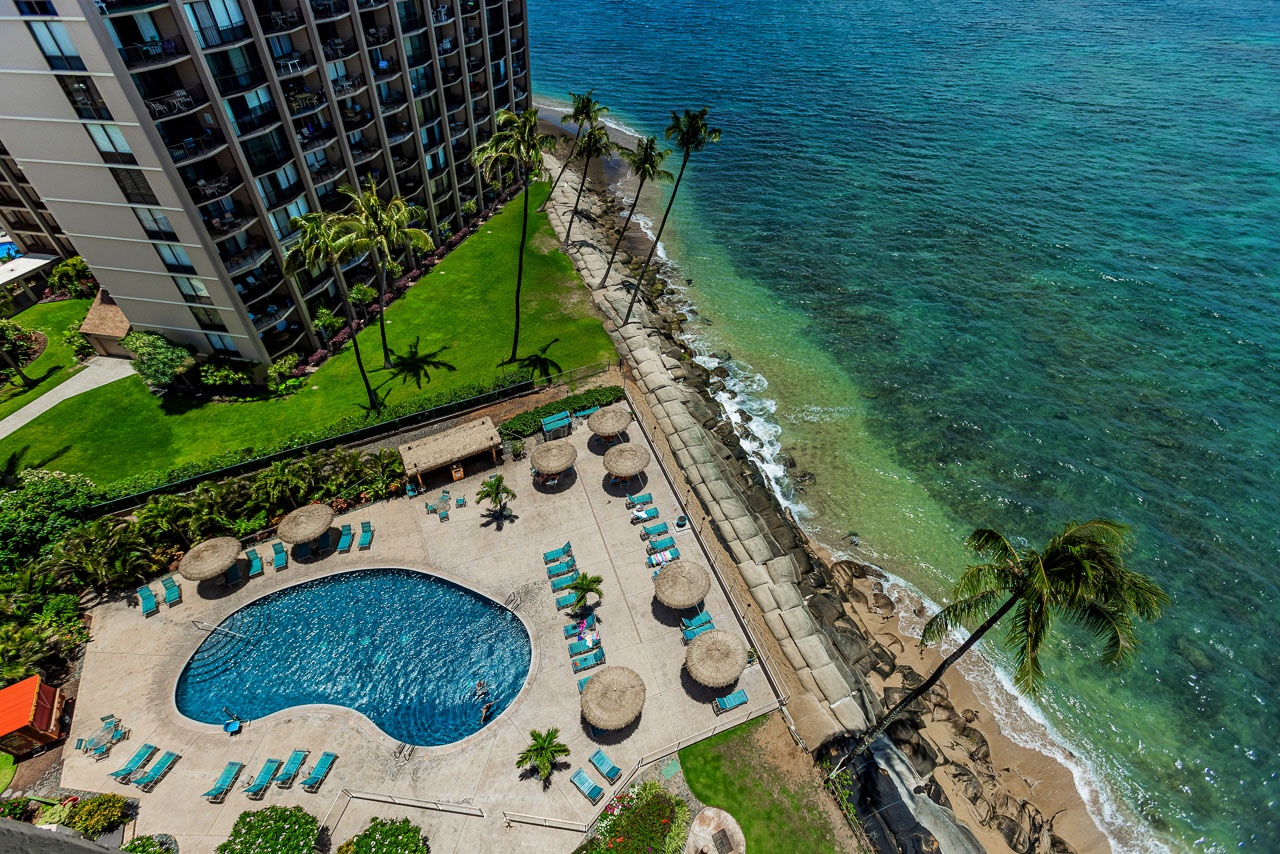 Aerial views of the pool framed by endless blue