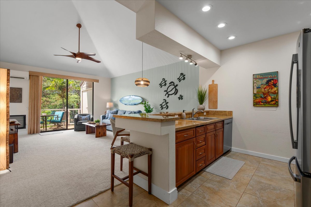 Picture yourself unwinding in this light-filled retreat, where thoughtful island touches meet all the comforts of home. Vaulted ceilings and tropical views create a relaxing, breezy escape perfect for your getaway.