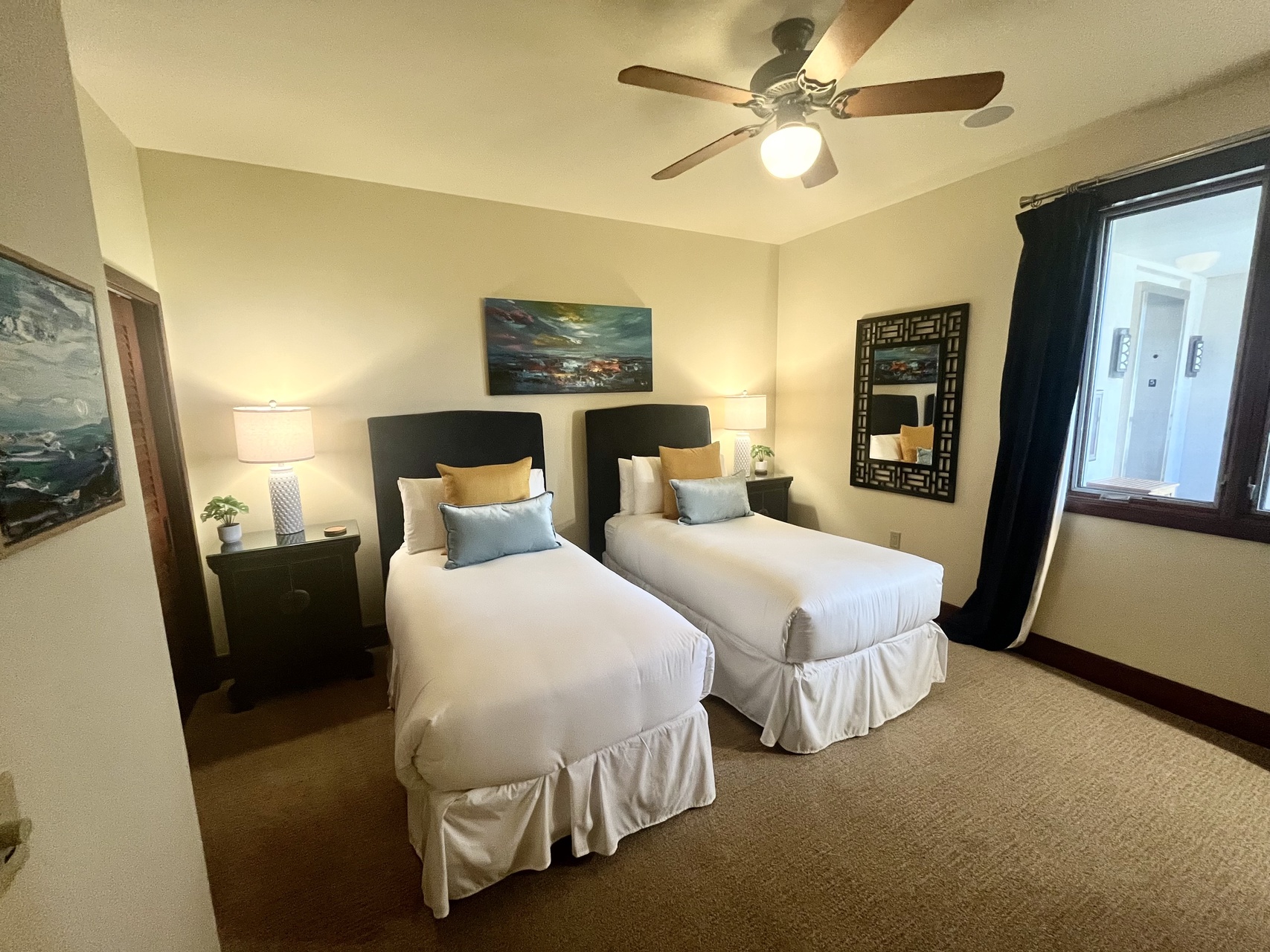 Guest bedroom with twin beds that can be converted to a king upon request.