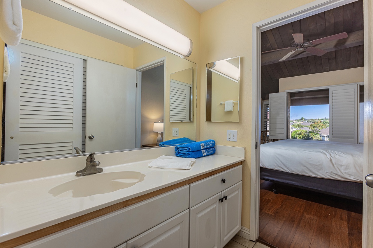 Lots of counter space and single vanity in the primary ensuite