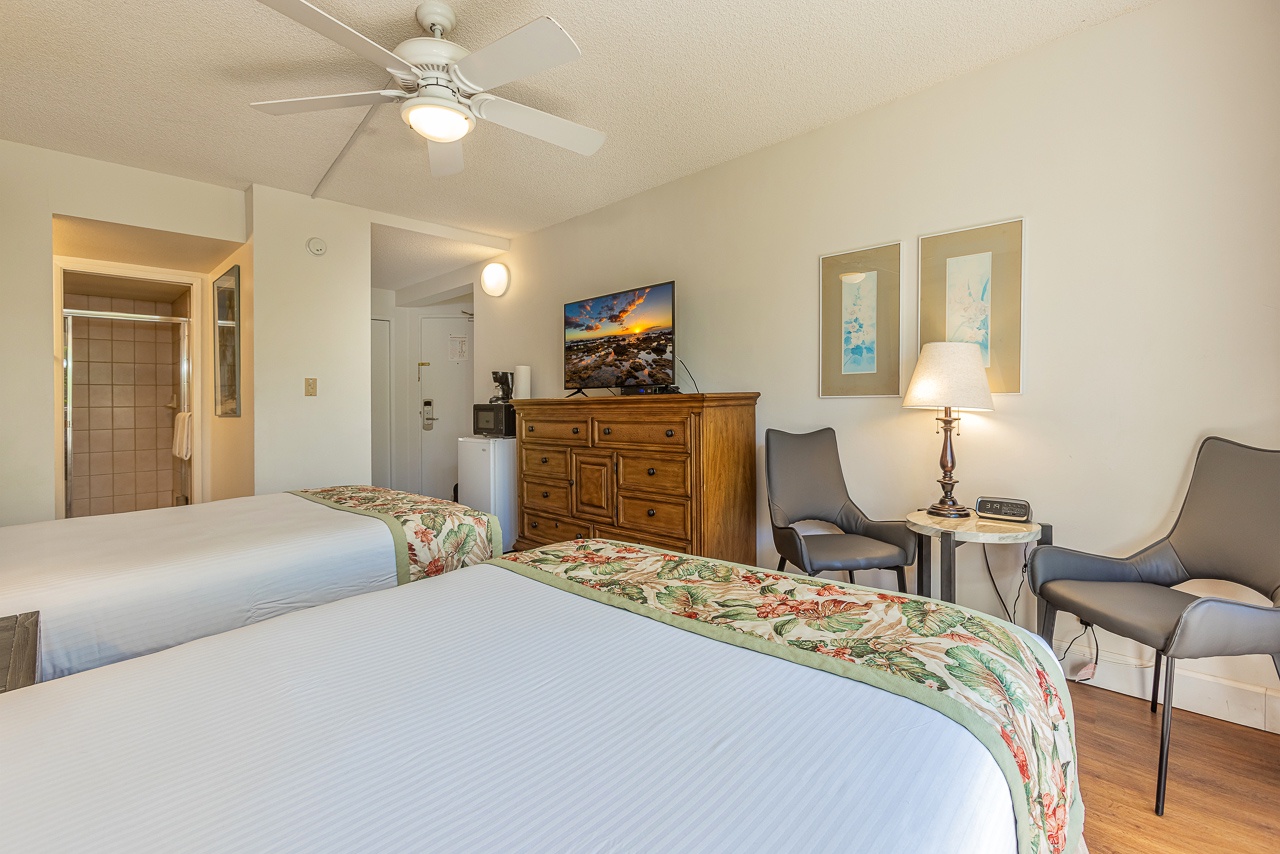 Comfortable studio setup with seating area and smart TV