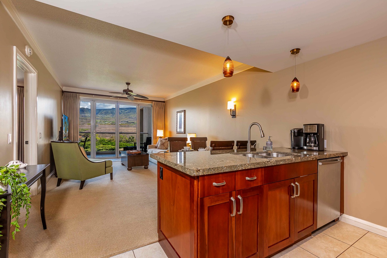 Inviting open-concept retreat with warm lighting, stunning mountain views, and glass doors opening to peaceful landscape. Perfect for morning coffee and unwinding.