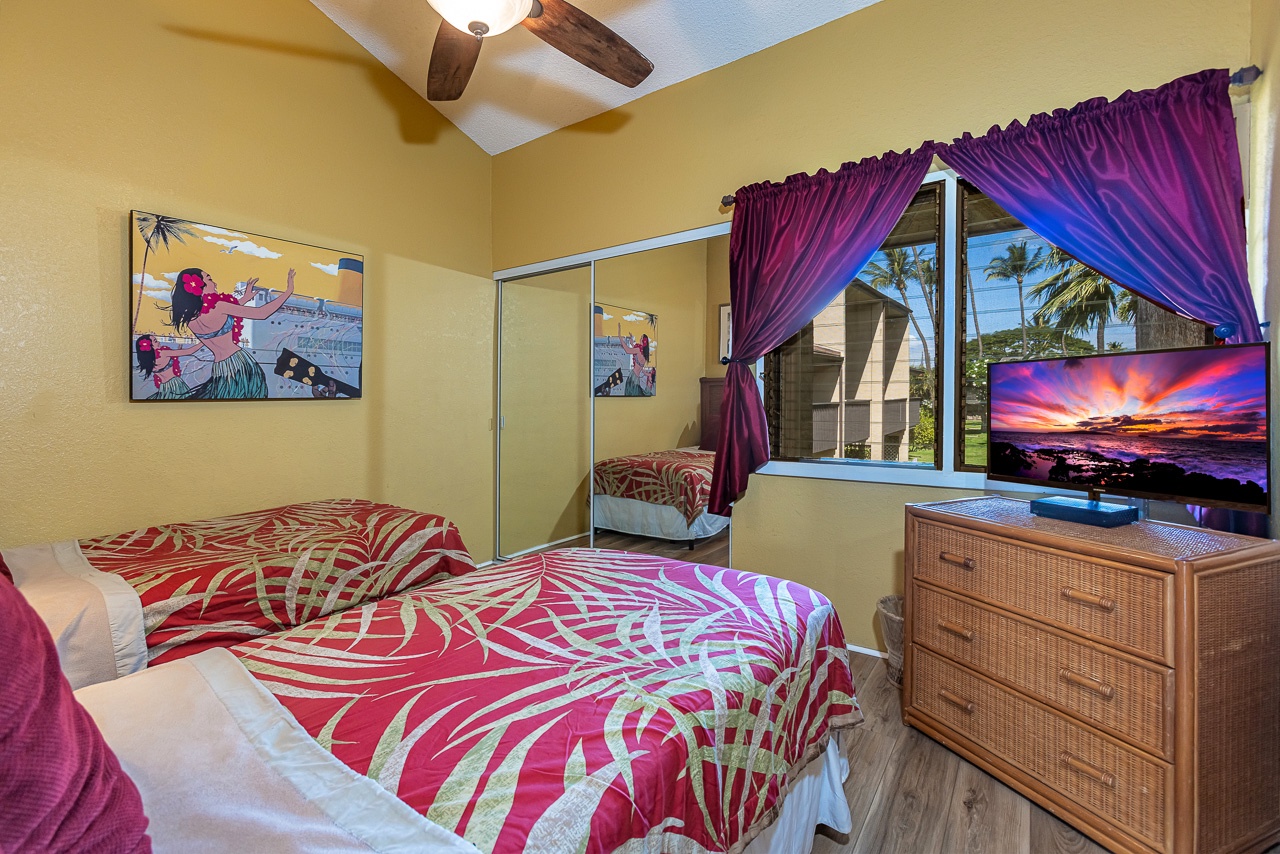 Fresh, cheerful room with bold island bedding and convenient storage