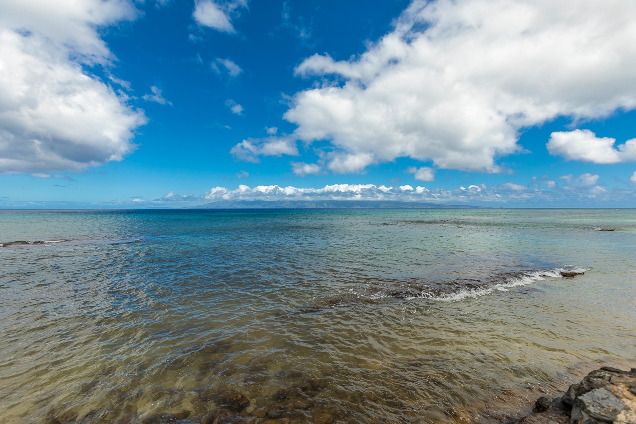Stunning coastal scenery with tranquil turquoise waters and bright blue skies near the property, offering a peaceful seaside atmosphere and natural beauty.