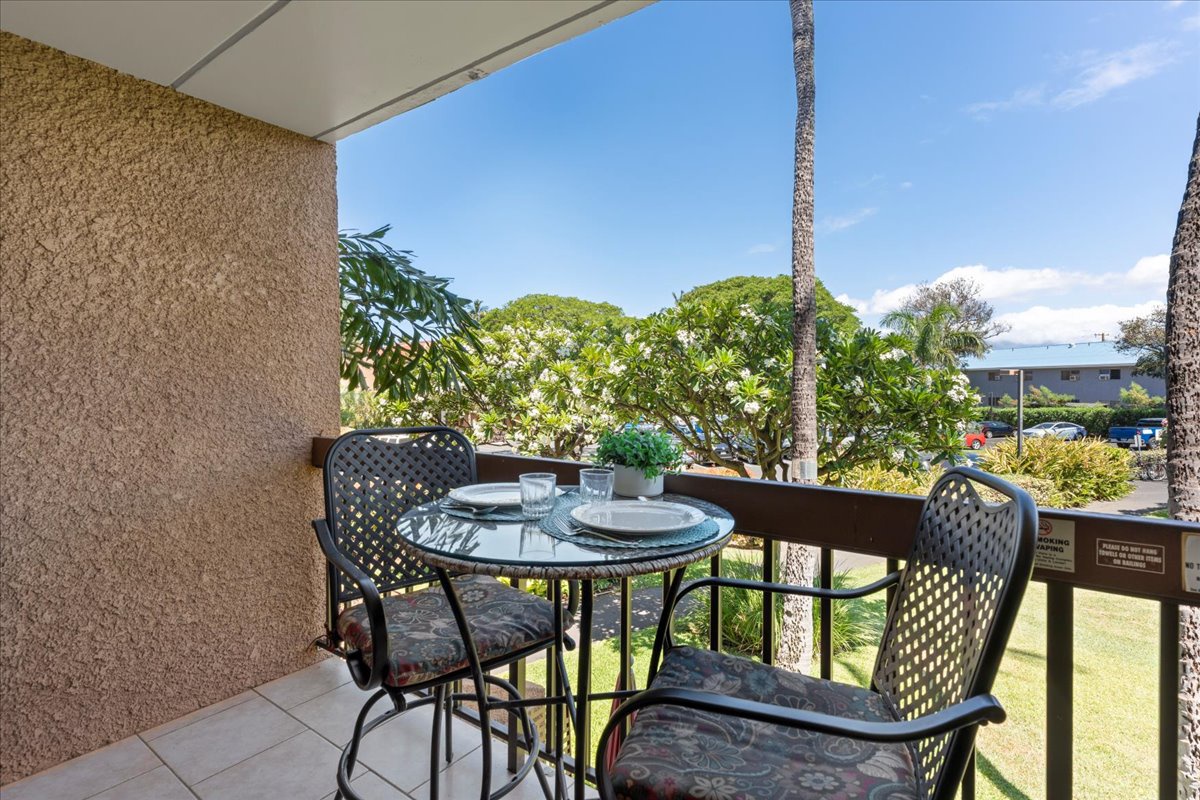 Your private balcony overlooks lush tropical gardens and swaying palms, perfect for morning coffee or evening relaxation with the gentle island breeze.