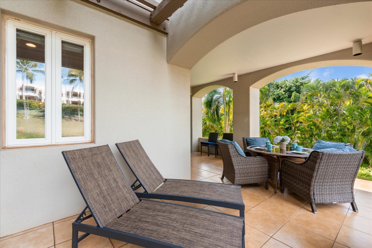 Lounge chairs and dining space make this lanai perfect for relaxing