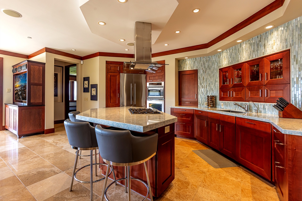 Step into this gourmet chef's kitchen, invite your culinary creativity. Gather around the spacious island for conversation and cooking in this beautifully appointed space.