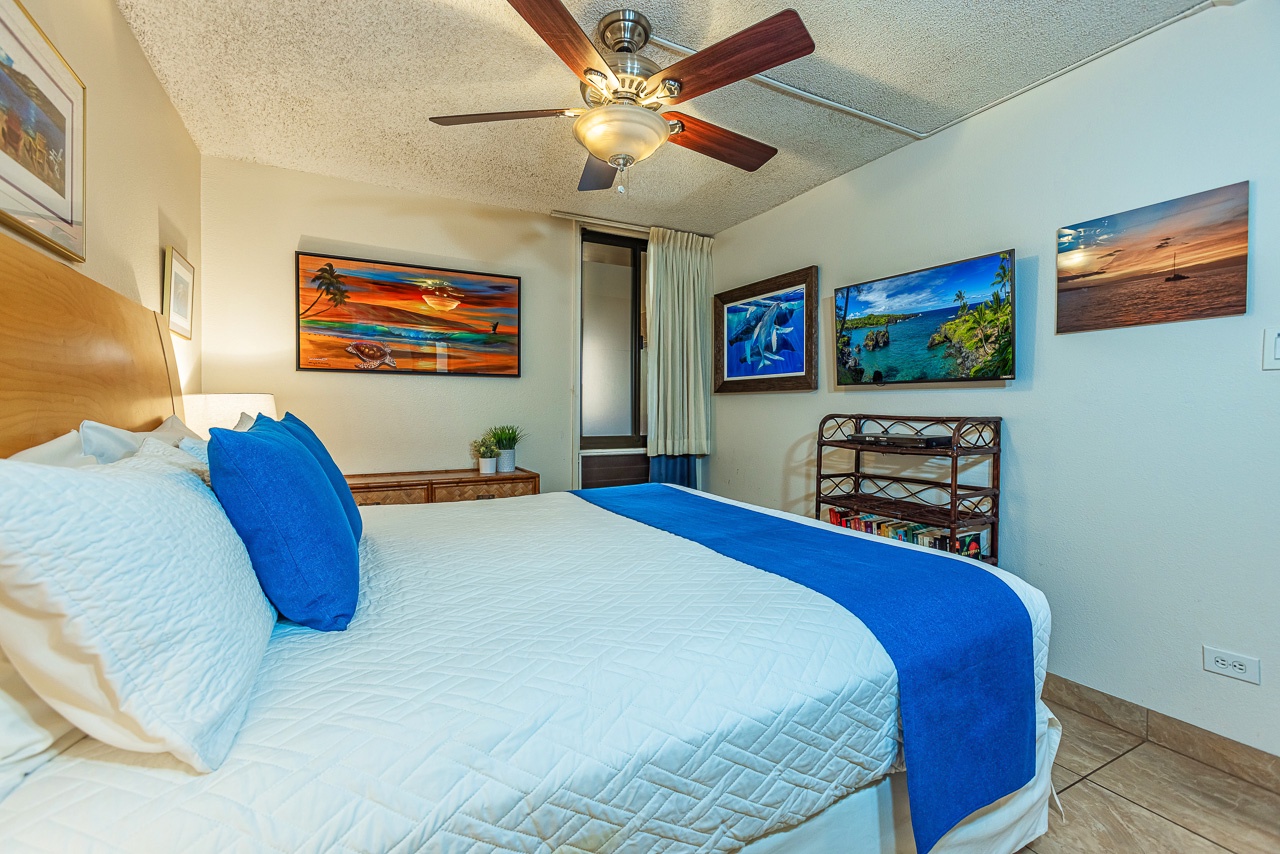 Unwind in your serene bedroom, where crisp linens and coastal artwork create a restful retreat after your island adventures.