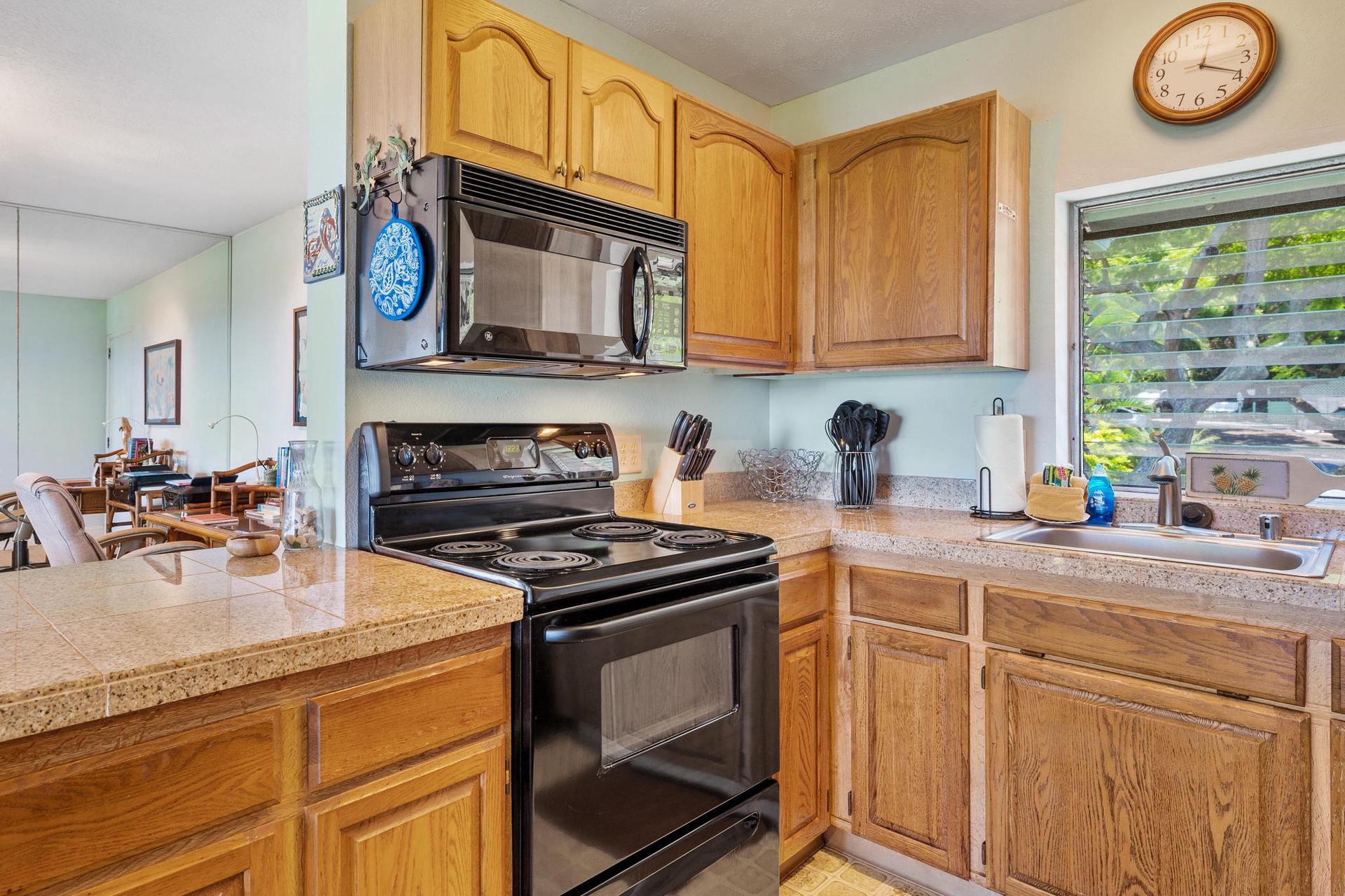 Your fully equipped kitchen offers granite counters, oak cabinets, and modern appliances for preparing memorable meals together.
