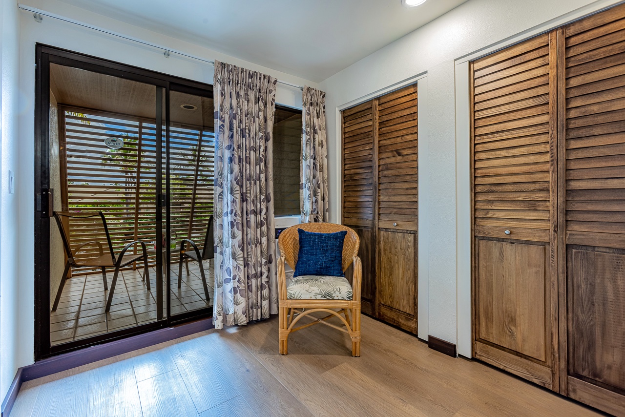 Slide open the doors to your private balcony and settle into the cozy wicker chair—your perfect spot to soak in the tropical breeze and unwind after a day exploring.