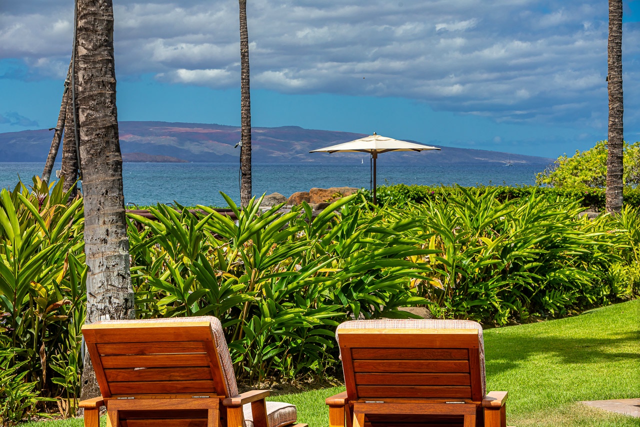 Settle into your lounger and let the gentle island breeze wash over you while tropical gardens frame sweeping ocean views and distant mountains paint the horizon.