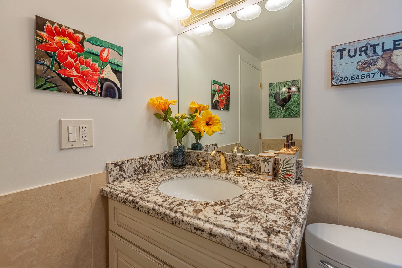 Cozy guest bathroom with fun turtle accents and tropical style