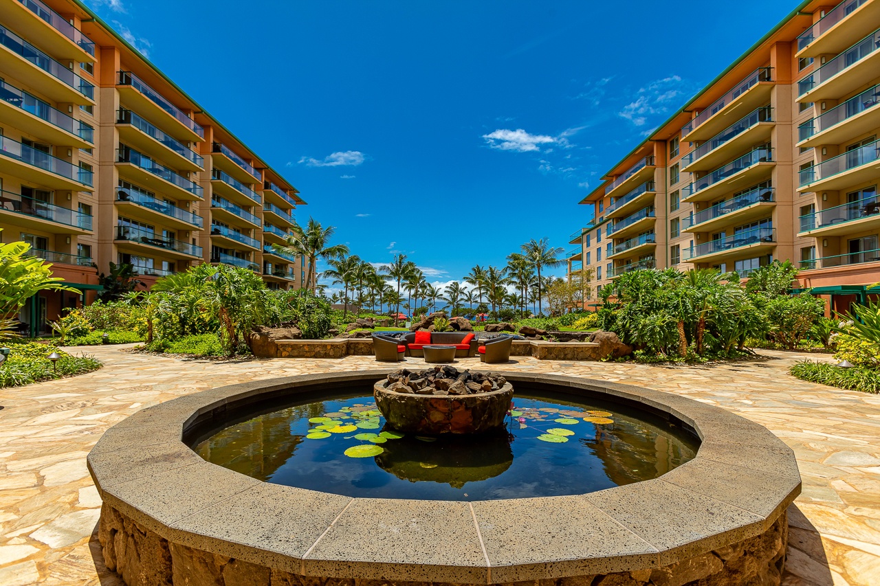 Step into the heart of the property where lush tropical gardens frame a serene fountain courtyard.
