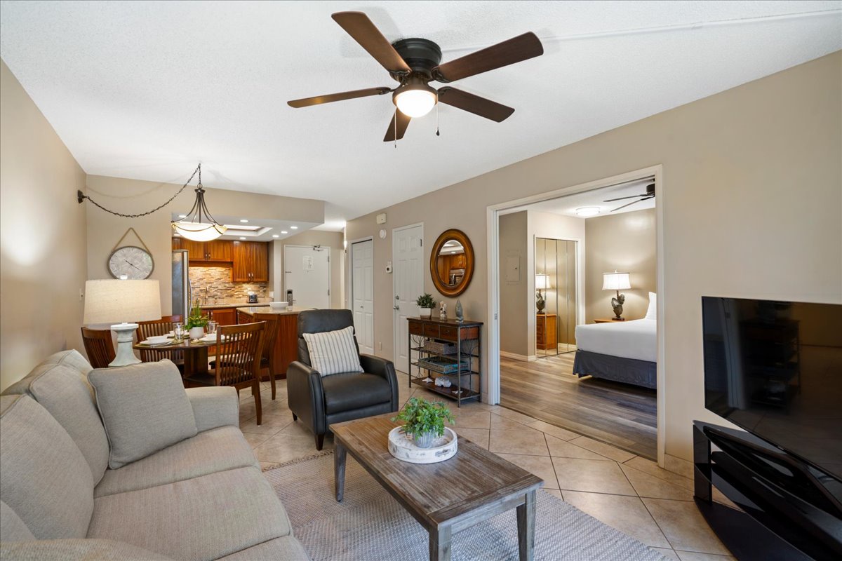 Open the French doors between the living room and bedroom