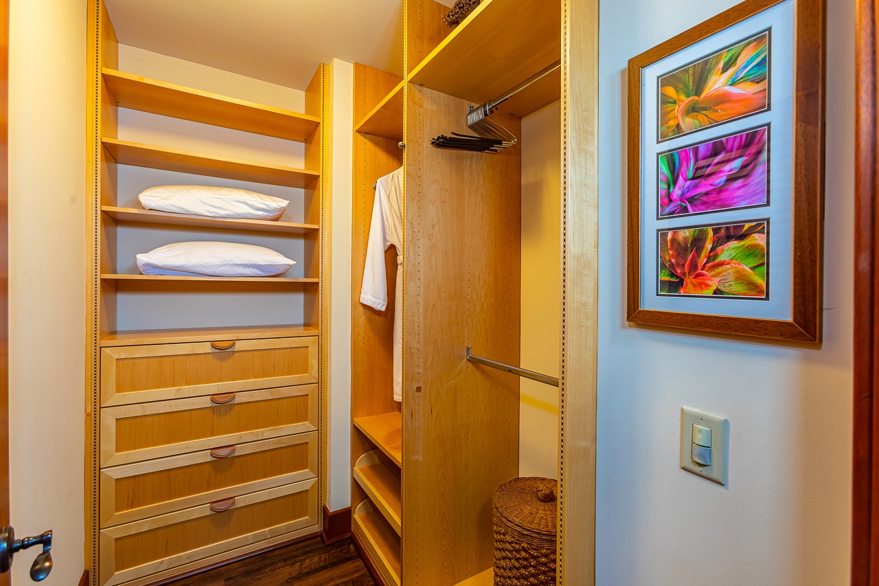 Your walk-in closet offers ample space with built-in shelving, hanging rods, and drawers—everything you need to unpack and settle in comfortably during your stay.