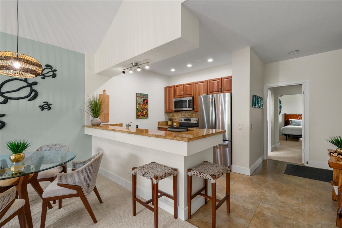 You'll love the spacious, open layout with a modern kitchen featuring stainless steel appliances and a breakfast bar—perfect for morning coffee or casual meals with family and friends.