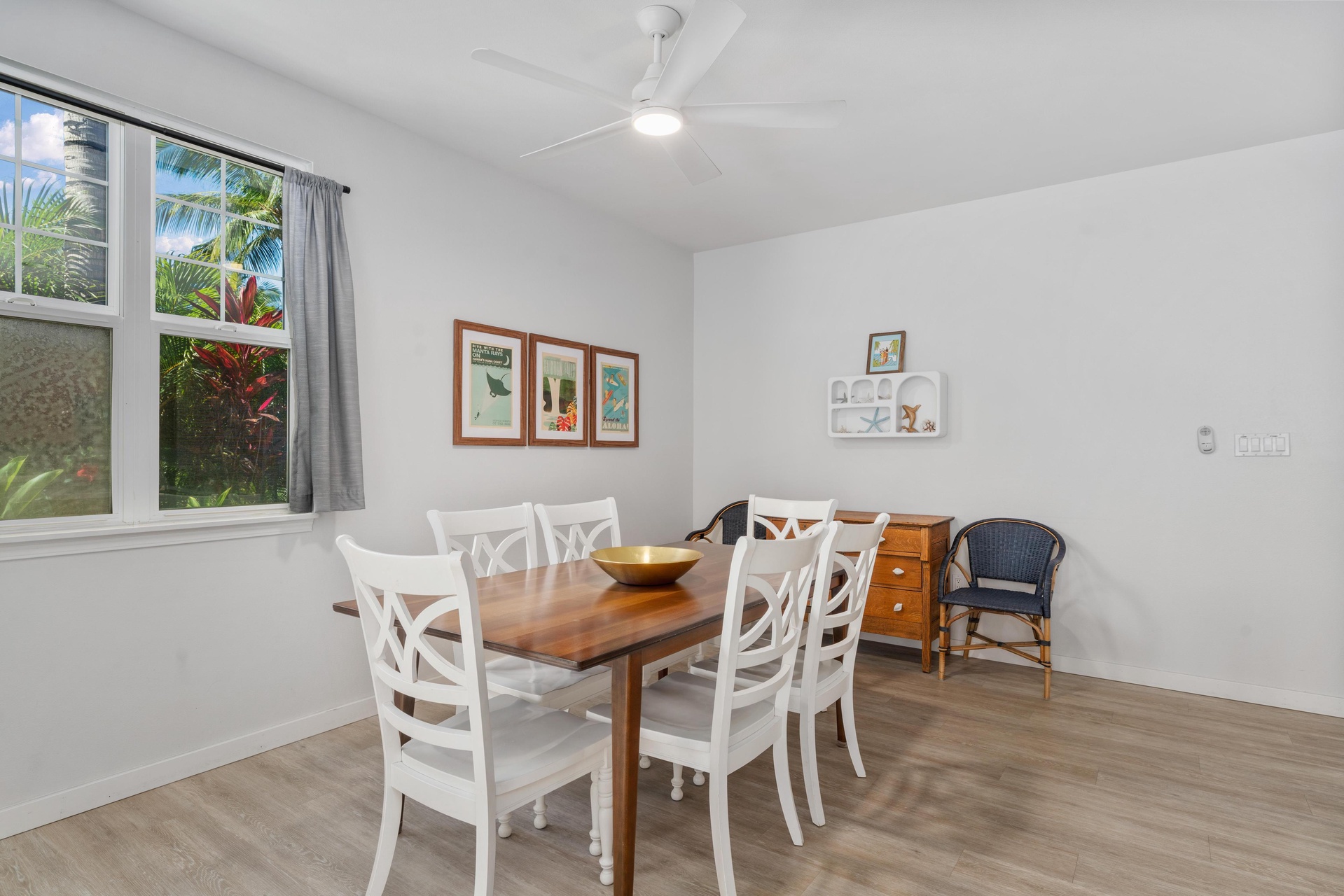 Gather around your spacious dining table with garden views streaming through the windows, perfect for memorable meals together.