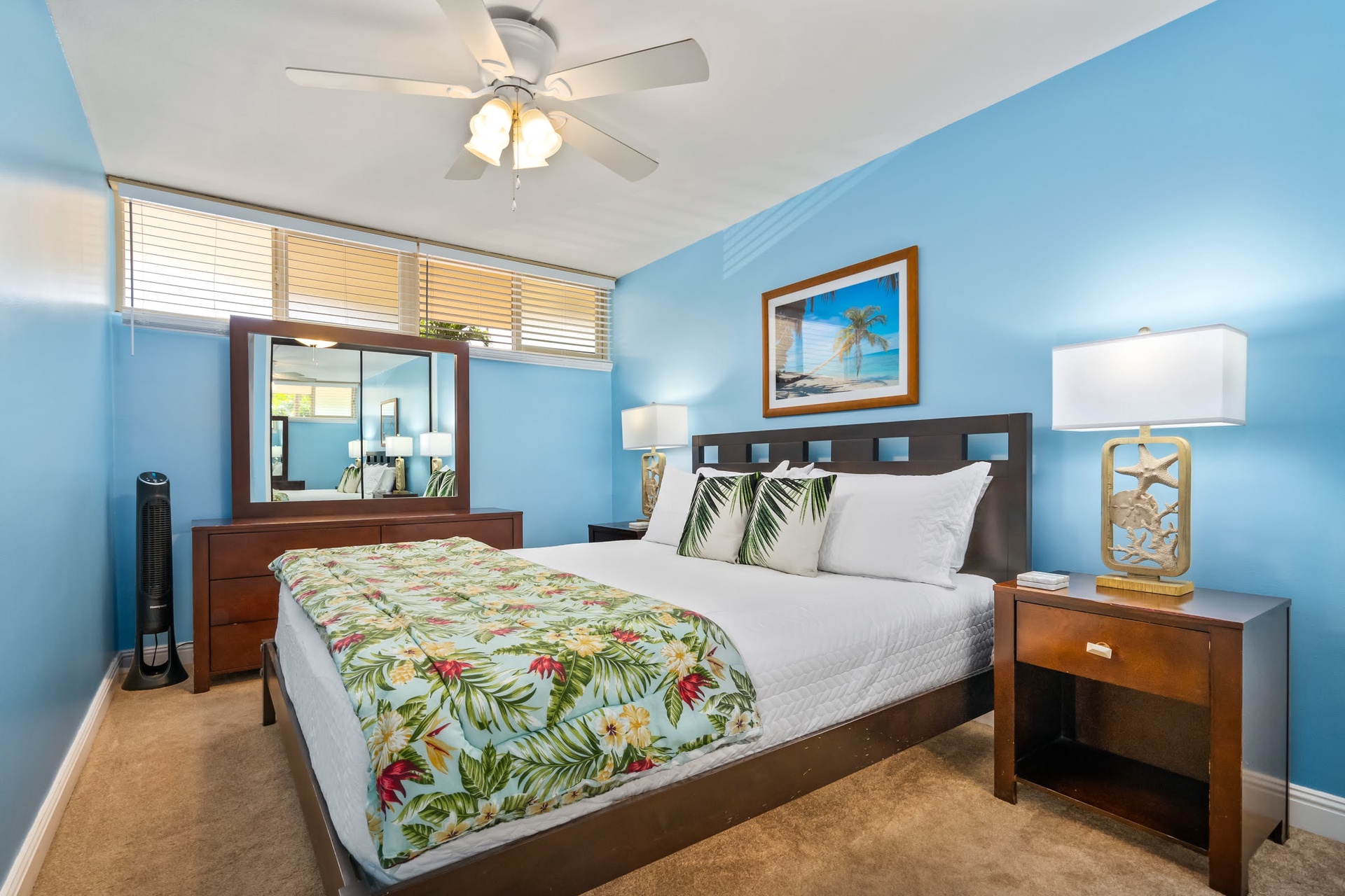 Wake up to soft coastal breezes and natural light in your serene retreat, where tropical hues and breezy decor set the tone for a relaxing escape.
