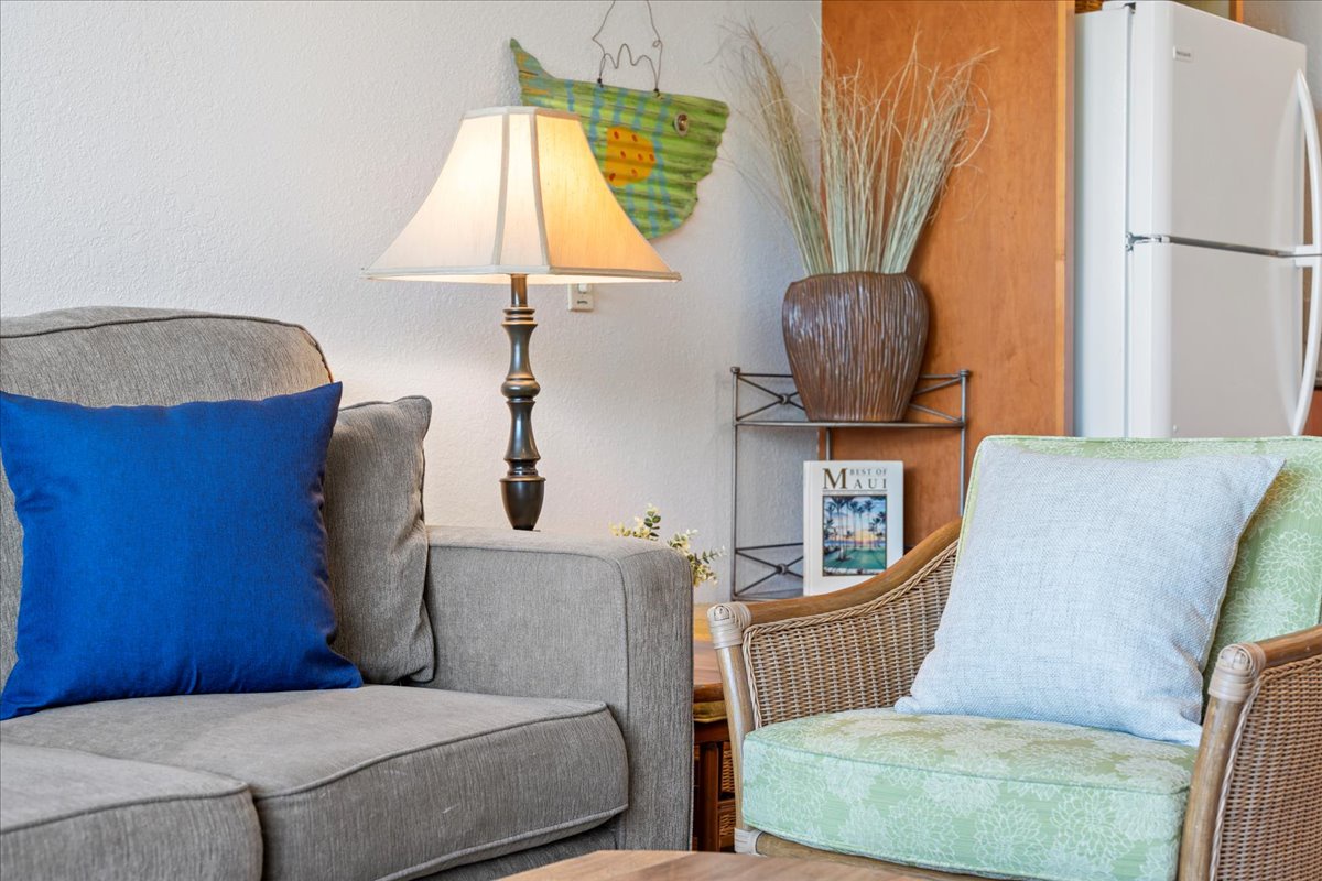Settle in for a relaxing stay in your cozy living area, where soft lighting and comfortable seating set the tone for peaceful island evenings.