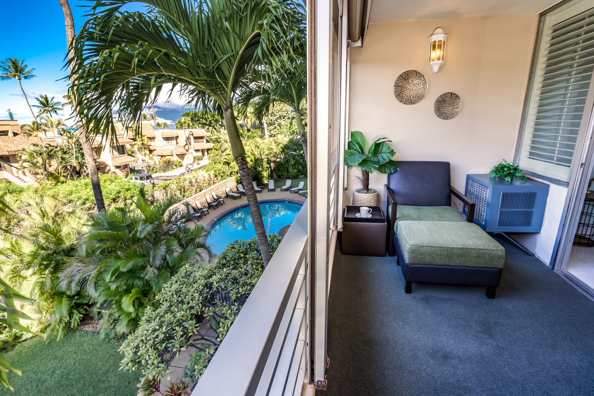 Your private lanai overlooks the sparkling pool and lush tropical gardens, a peaceful retreat where you can unwind with morning coffee or evening relaxation in island paradise.