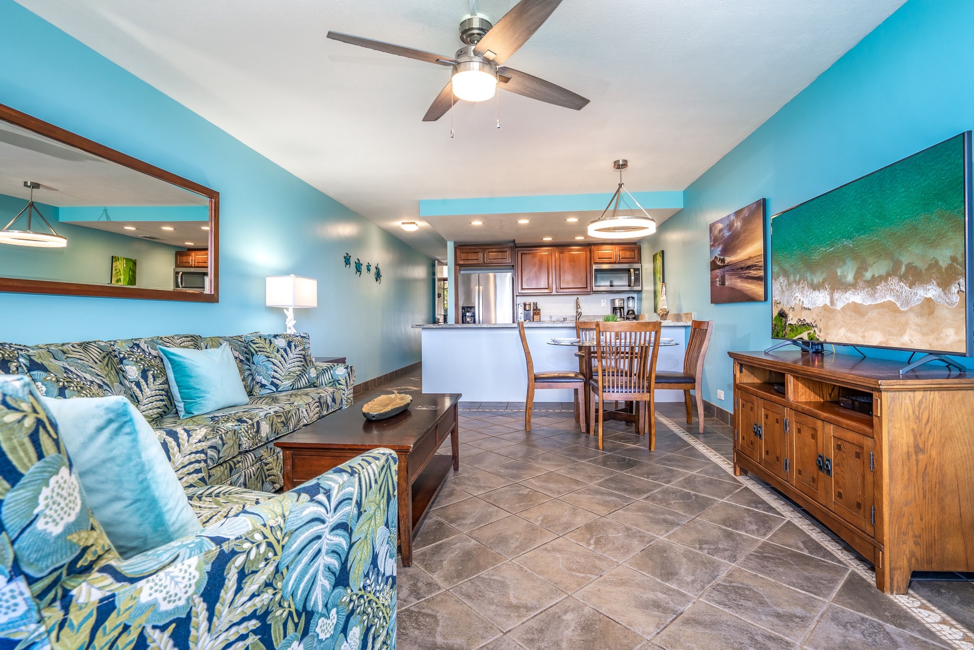 Picture yourself relaxing in this airy, tropical-inspired space where cool ocean breezes and vibrant island colors welcome you home after a day of adventure.