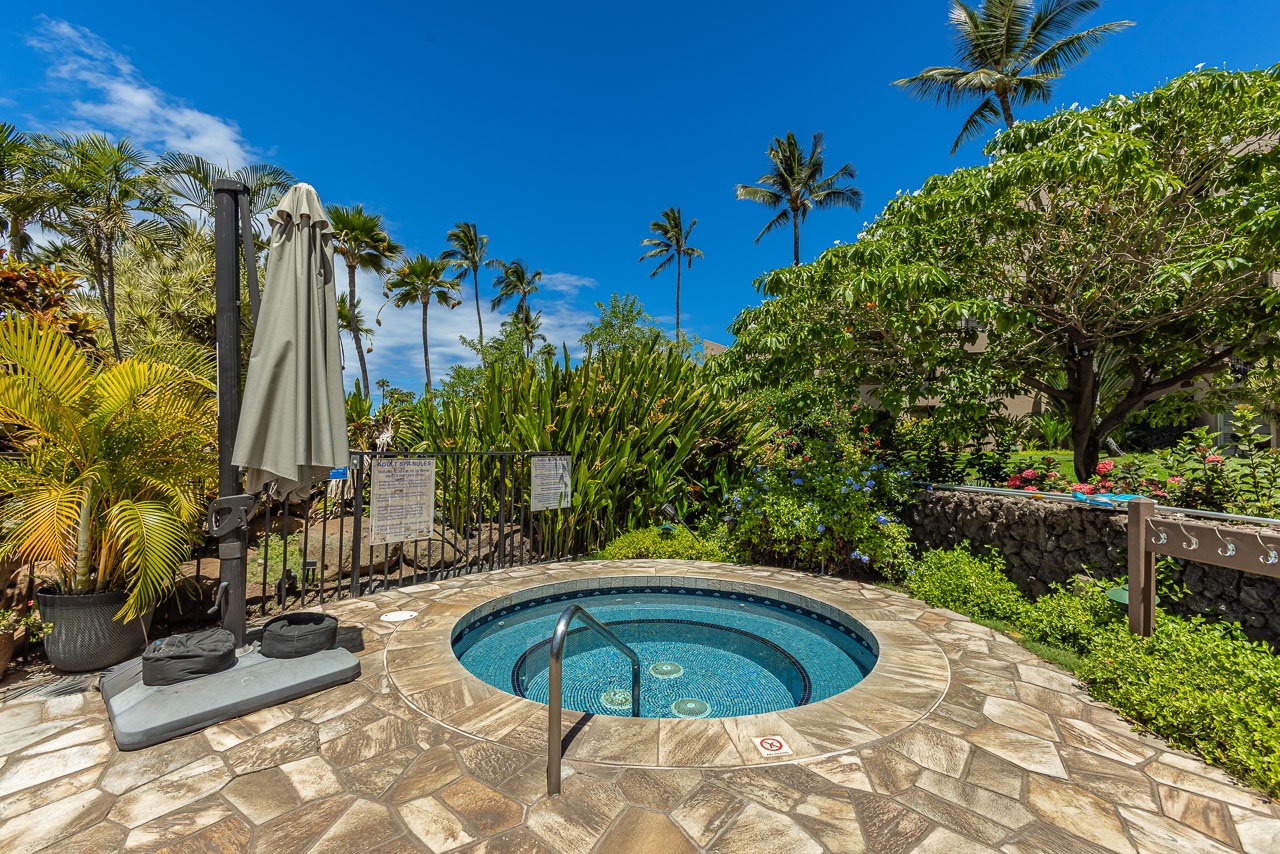 This tropical oasis invites you to unwind in a sunlit hot tub, surrounded by swaying palms and lush greenery under an endless blue sky.