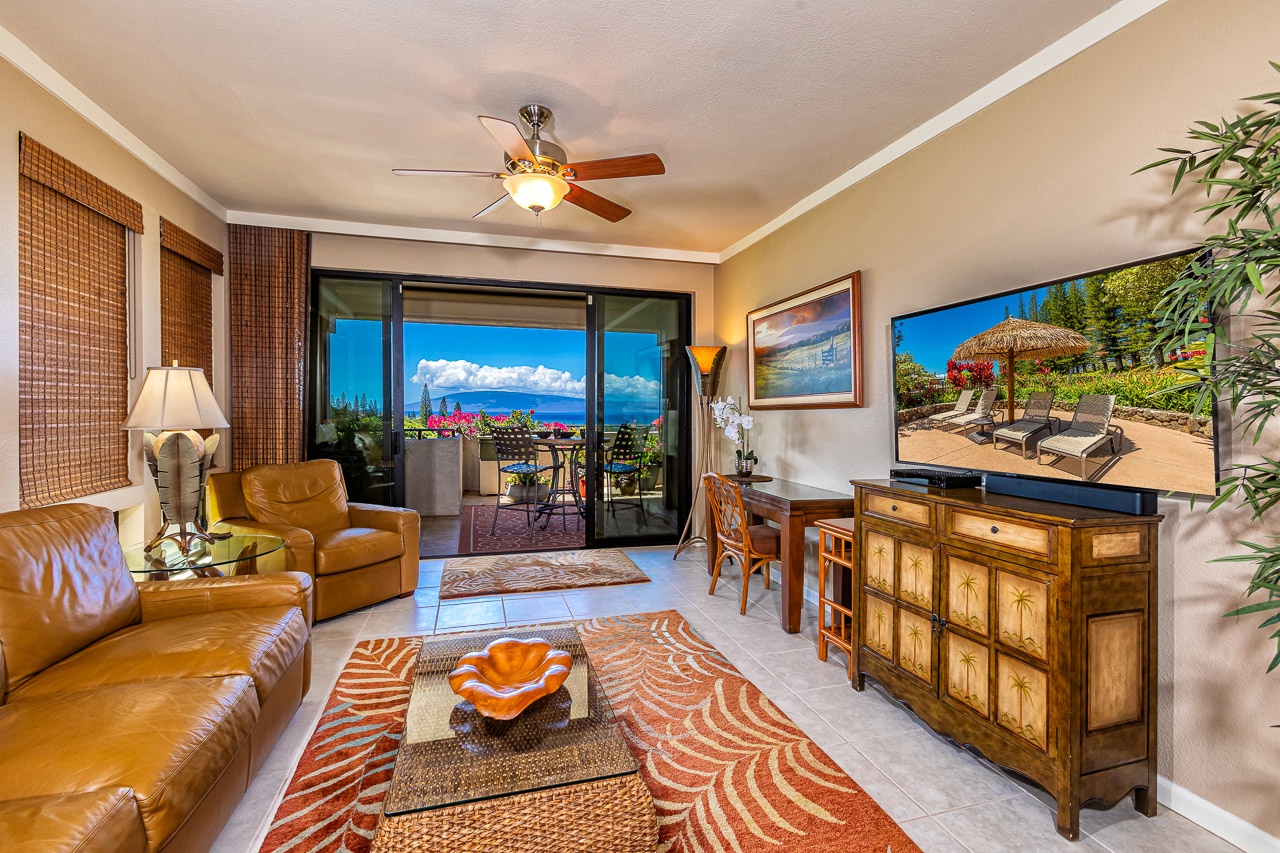 Step into your island retreat where tropical breezes flow through open doors, revealing stunning ocean vistas. Sink into plush leather seating as you enjoy seamless indoor-outdoor living with access to your private lanai.