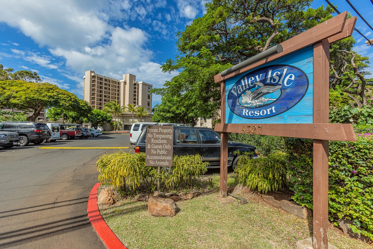 Valley Isle Resort greets you with its signature sign and lush tropical landscaping, marking the start of your island getaway.