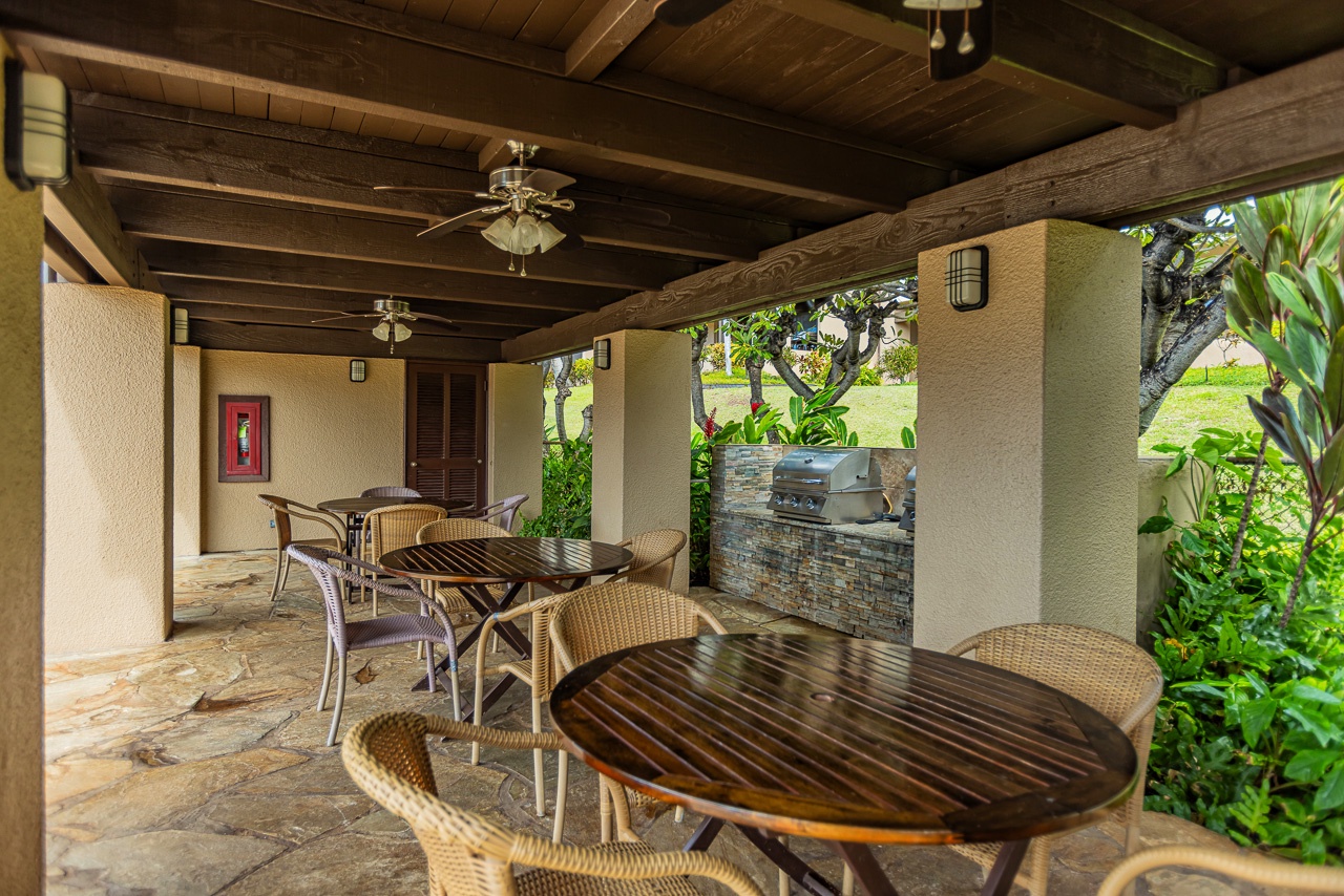 Your covered outdoor dining patio with ceiling fans and built-in BBQ grill.