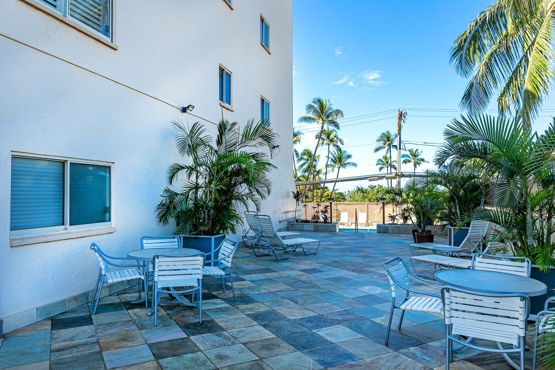 Outdoor dining and BBQ space beside the pool