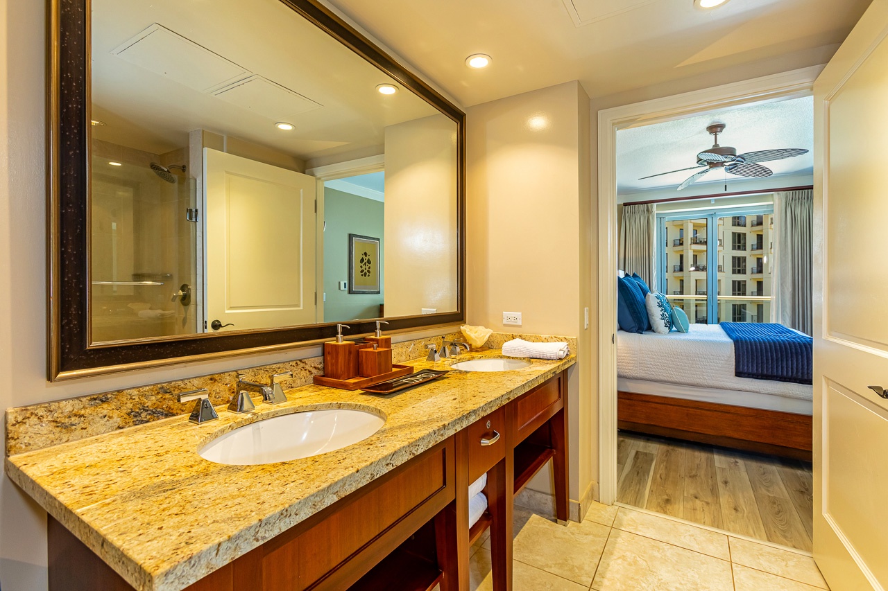 Step into your private bathroom with granite countertop and fresh towels. Everything is ready for your arrival.